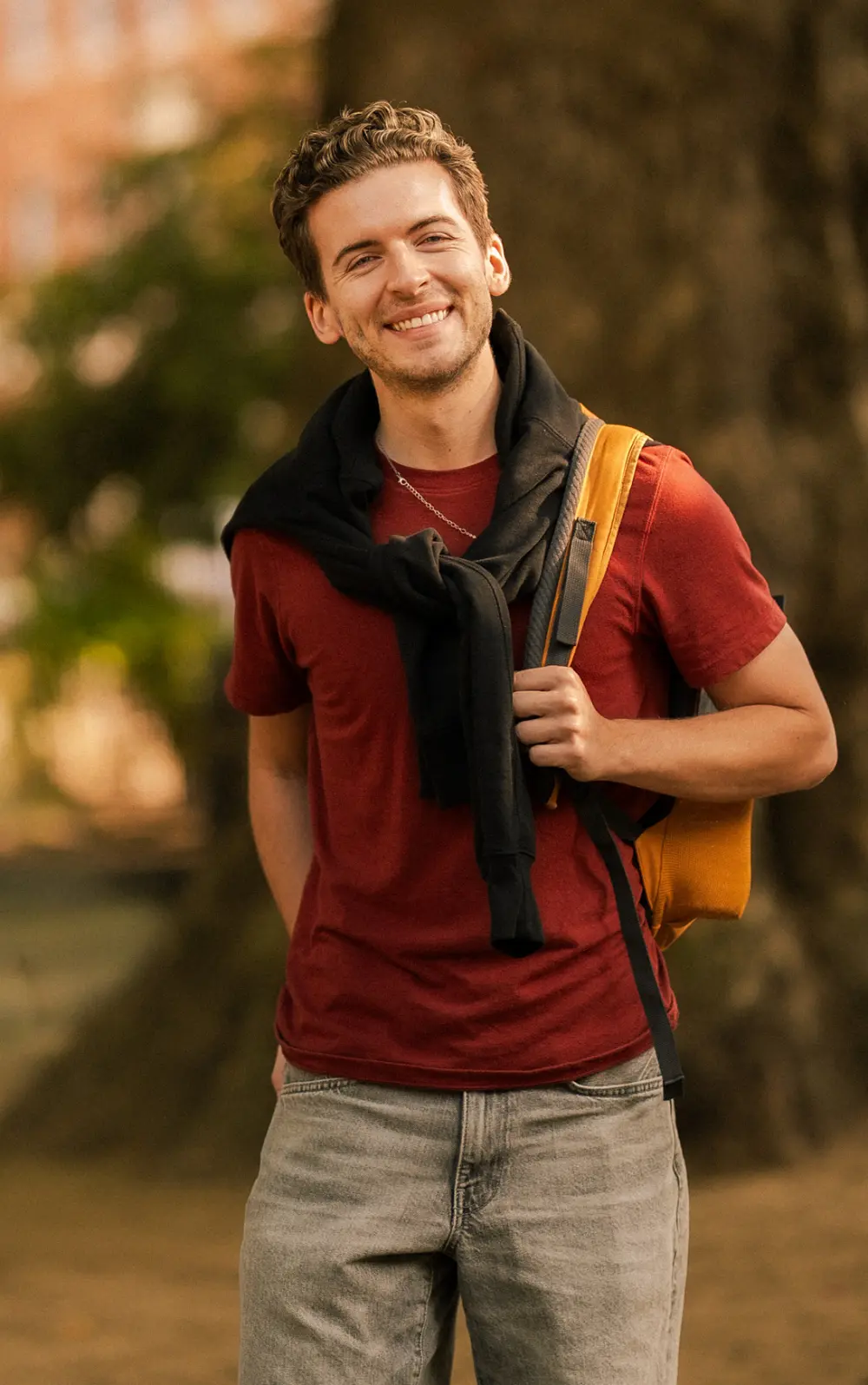 Dylan smiling in golden hour light